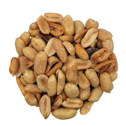 Roasted peanuts in a clear glass bowl, photographed from a top-down view on a clean white background.