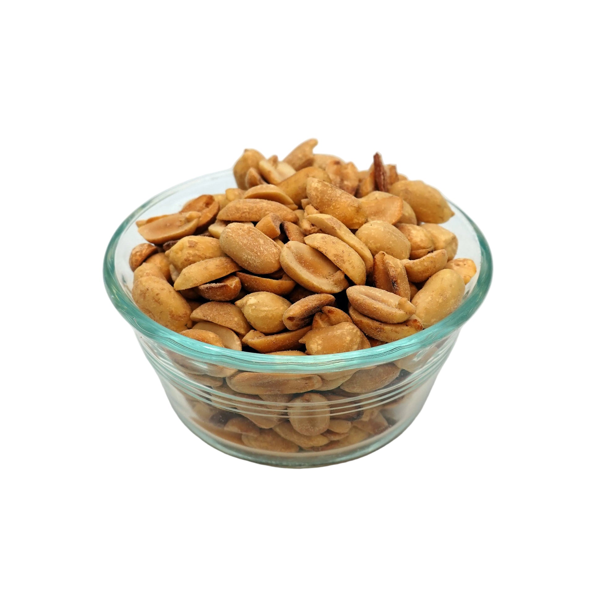 Roasted peanuts in a small clear glass bowl, photographed on a plain light gray studio background.