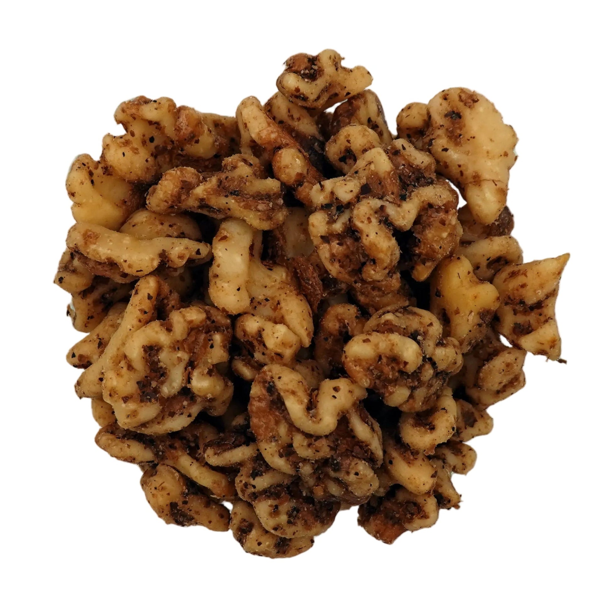 A top-down view of salted walnuts in a clear glass bowl on a plain white background.