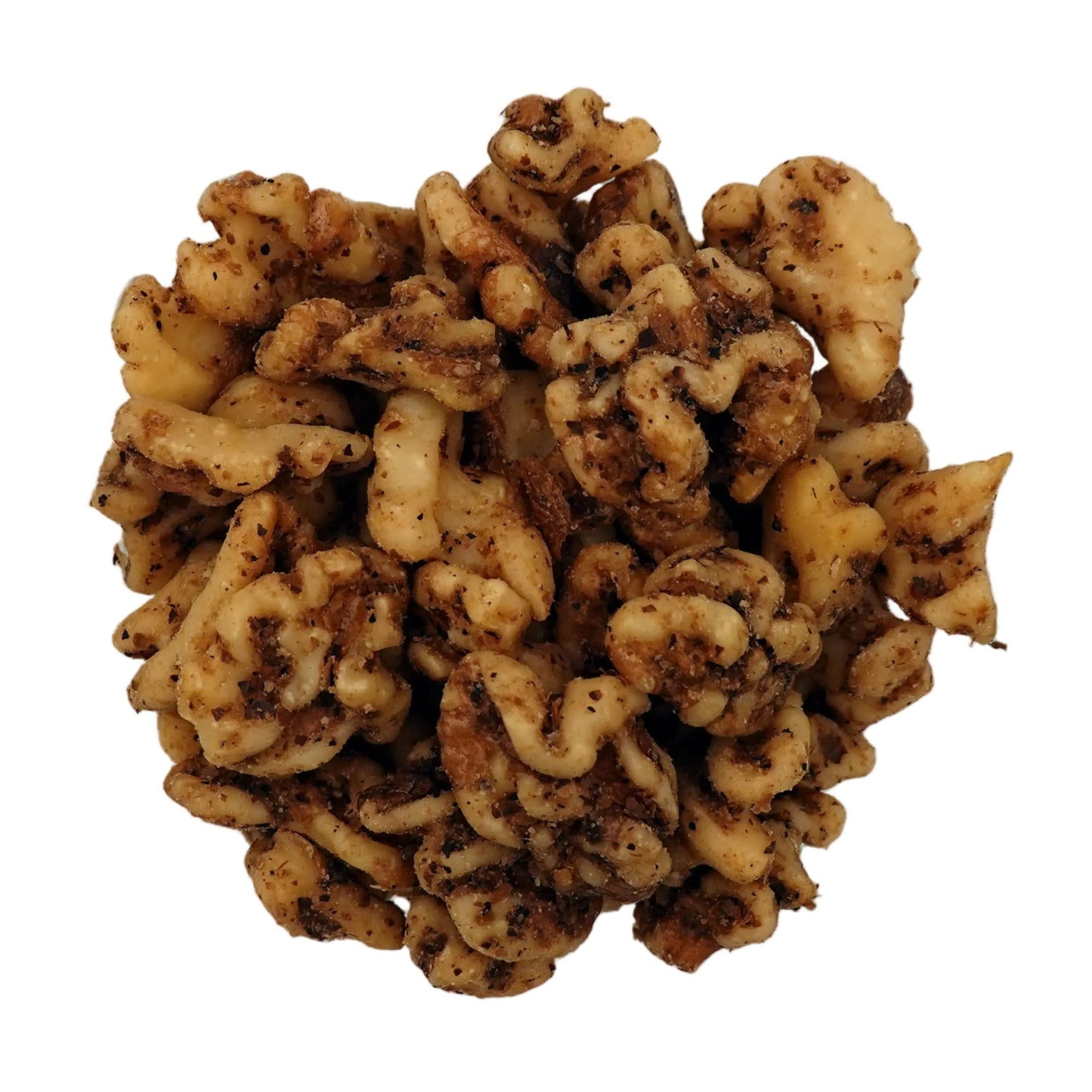 A top-down view of unsalted walnuts in a clear glass bowl on a plain white background.