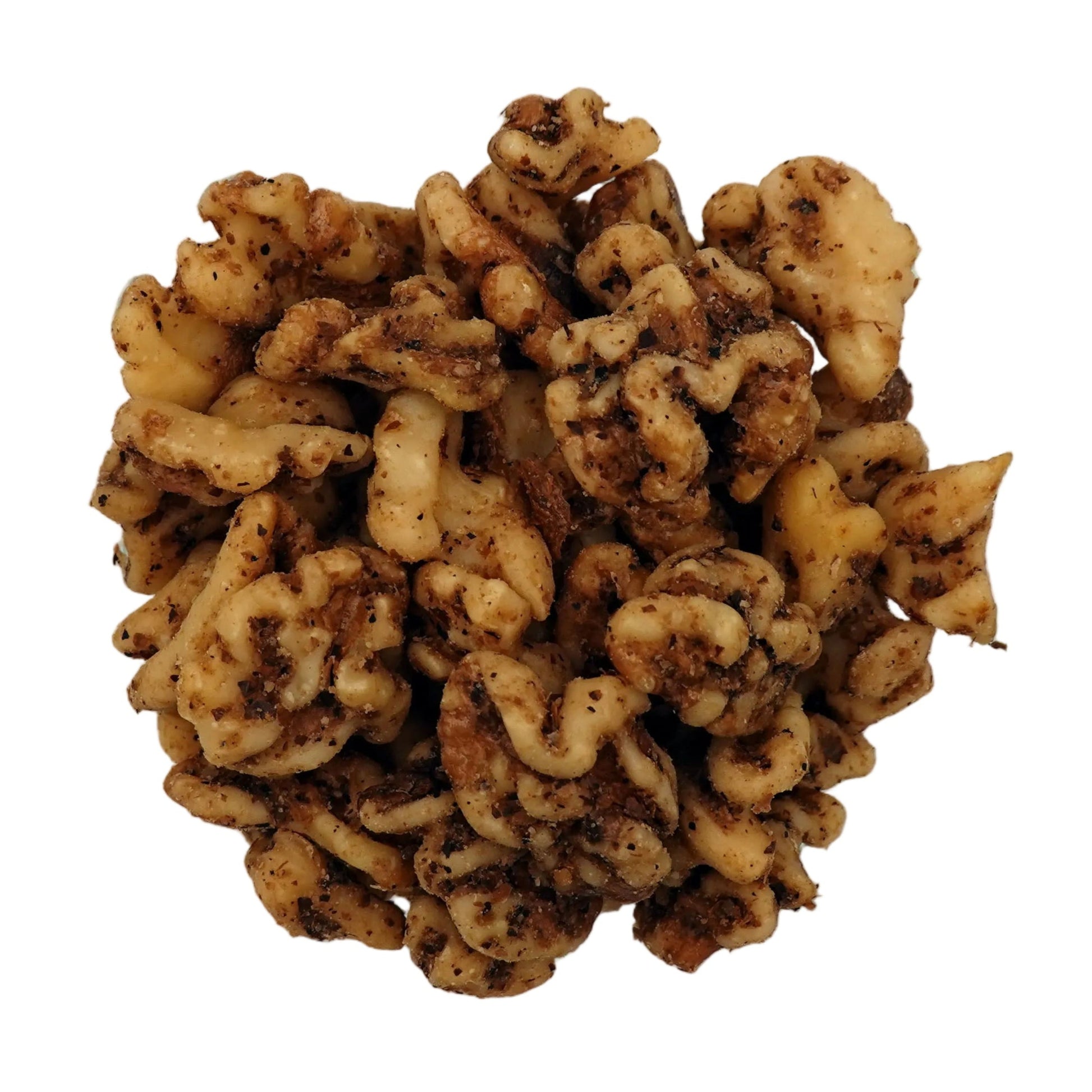 A top-down view of unsalted walnuts in a clear glass bowl on a plain white background.