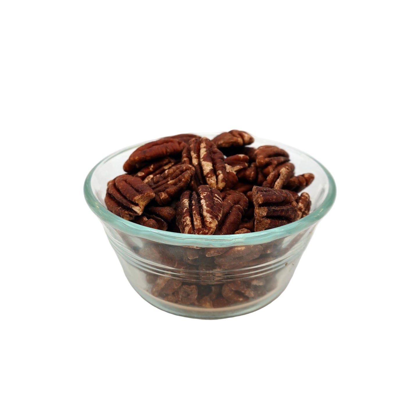 A clear glass bowl filled with unsalted pecans on a light gray studio background.