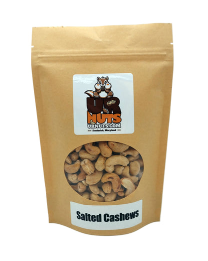 A stand-up kraft paper pouch of UR Nuts brand Salted Cashews, featuring a clear circular window showing the cashews inside and a white label at the bottom with the text 'Salted Cashews'.