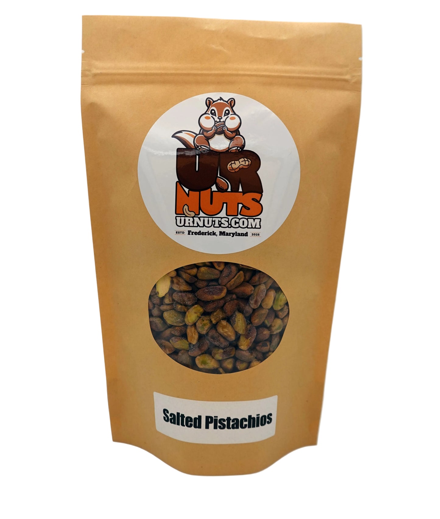 A stand-up kraft paper pouch of UR NUTS brand 'Salted Pistachios' on a white studio background. The pouch features a circular white label with the UR NUTS cartoon squirrel logo and a clear window showing the brown and green pistachios inside.