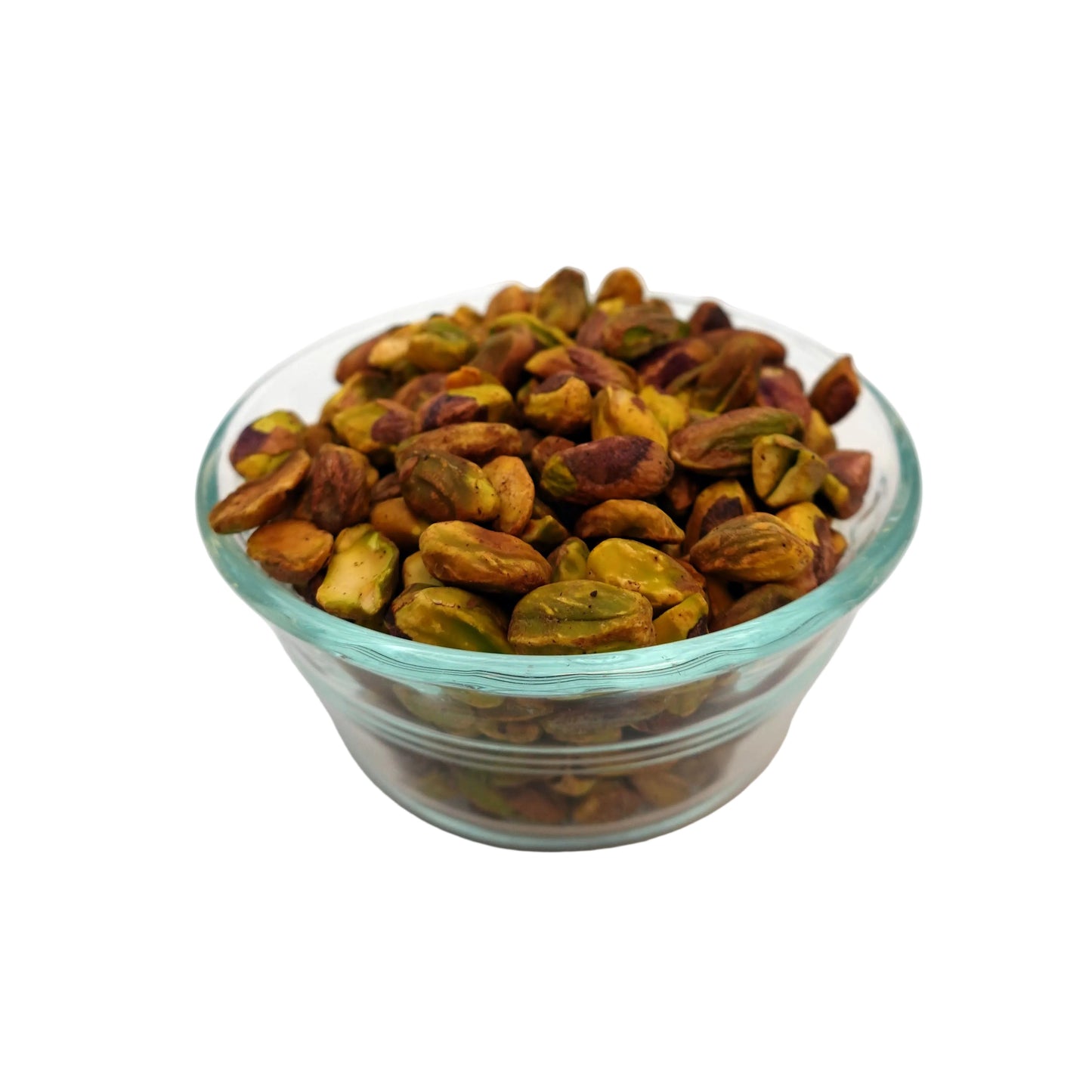 A clear glass bowl filled with unsalted pistachios on a clean white background.