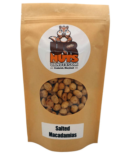 A stand-up kraft paper pouch of UR Nuts Salted Macadamias, featuring a circular cartoon squirrel logo and a clear window showing the nuts inside.