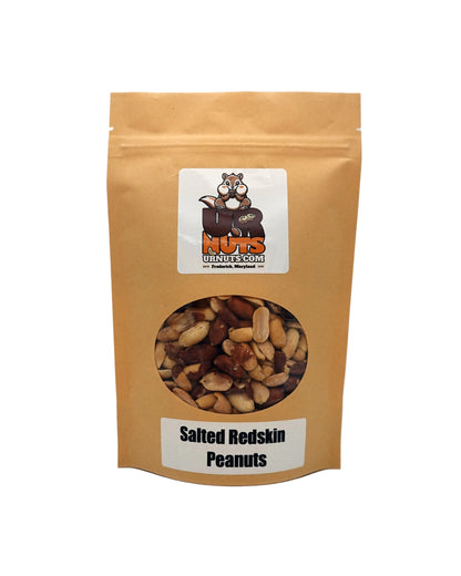 A stand-up kraft paper pouch of Salted Redskin Peanuts with a clear window showing the peanuts inside, on a light gray background.