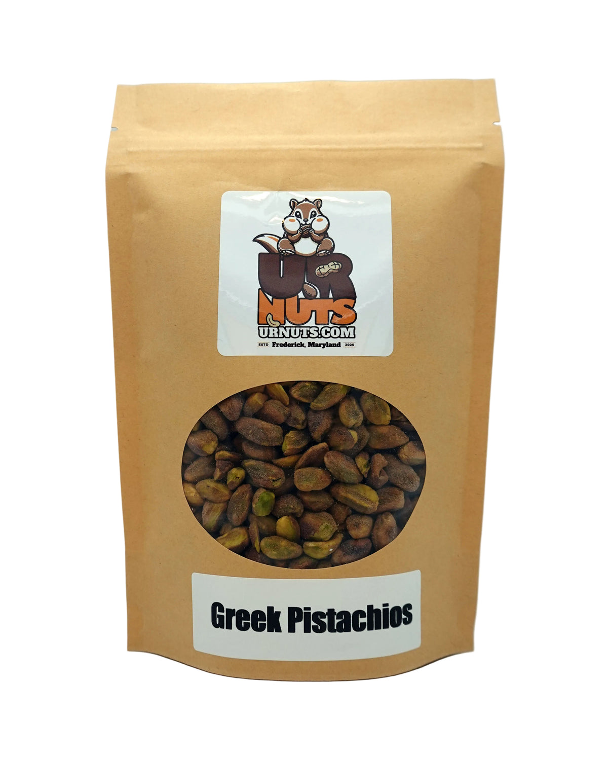 A stand-up kraft paper pouch of Greek Pistachios with a clear circular window showing the pistachios inside. The pouch features a white label at the top with a cartoon nut logo and a white label at the bottom reading 'Greek Pistachios'.