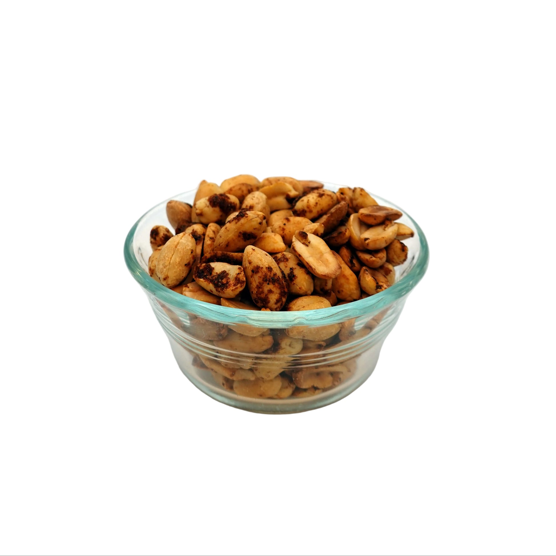 Roasted chili lime peanuts in a small clear glass bowl, set against a seamless white studio background.