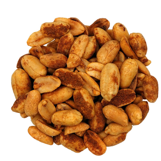 Roasted Old Bay Peanuts in a clear glass bowl, photographed from a top-down view on a clean white background.