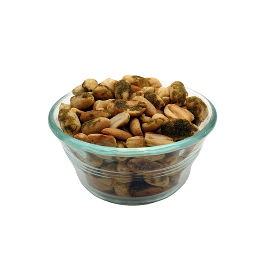 A top-down view of a clear glass bowl filled with Smoky Jalapeño Peanuts, on a plain white background.
