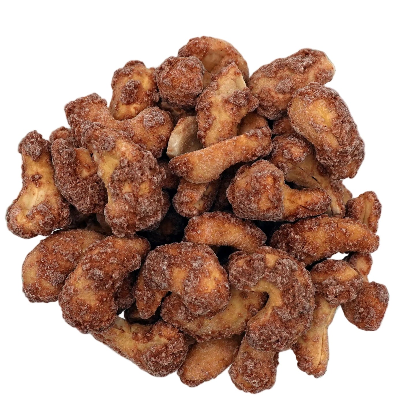 Cinnamon glazed cashews piled in a clear glass bowl, photographed from directly above on a clean white background.