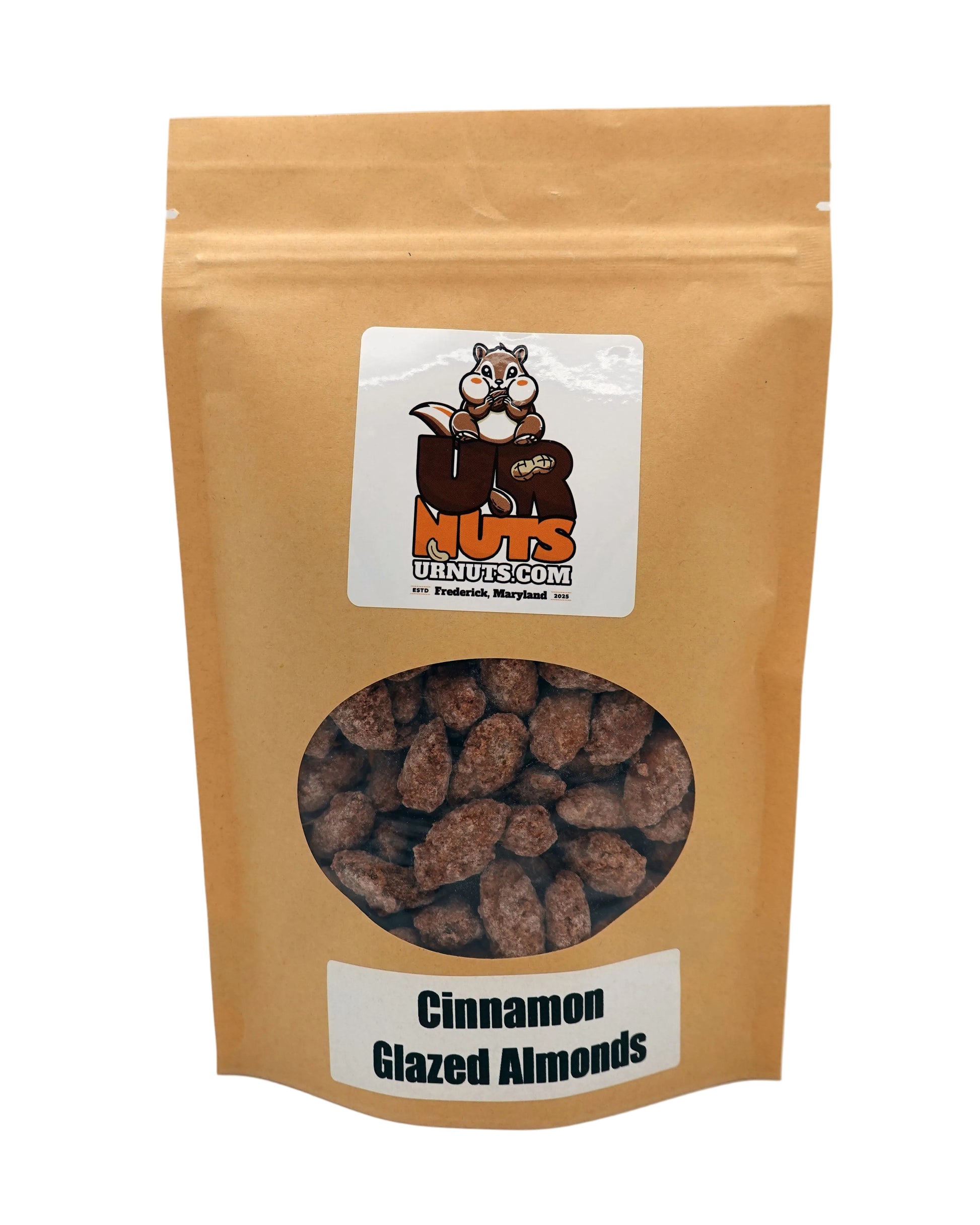 A stand-up kraft paper pouch of UR Nuts Cinnamon Glazed Almonds, featuring a clear circular window showing the almonds inside and a white label with the brand logo.