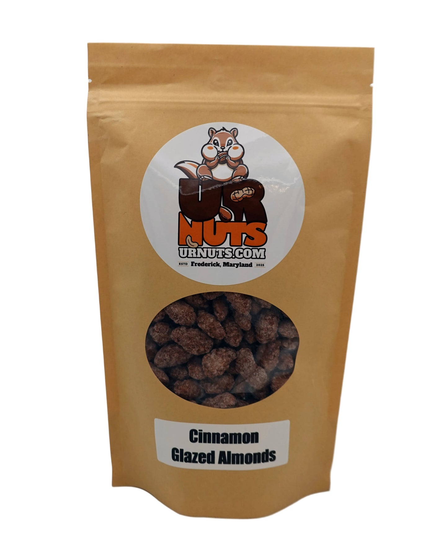 A stand-up kraft paper pouch of UR Nuts Cinnamon Glazed Almonds, featuring a circular cartoon squirrel logo and a clear window showing the brown almond pieces inside.