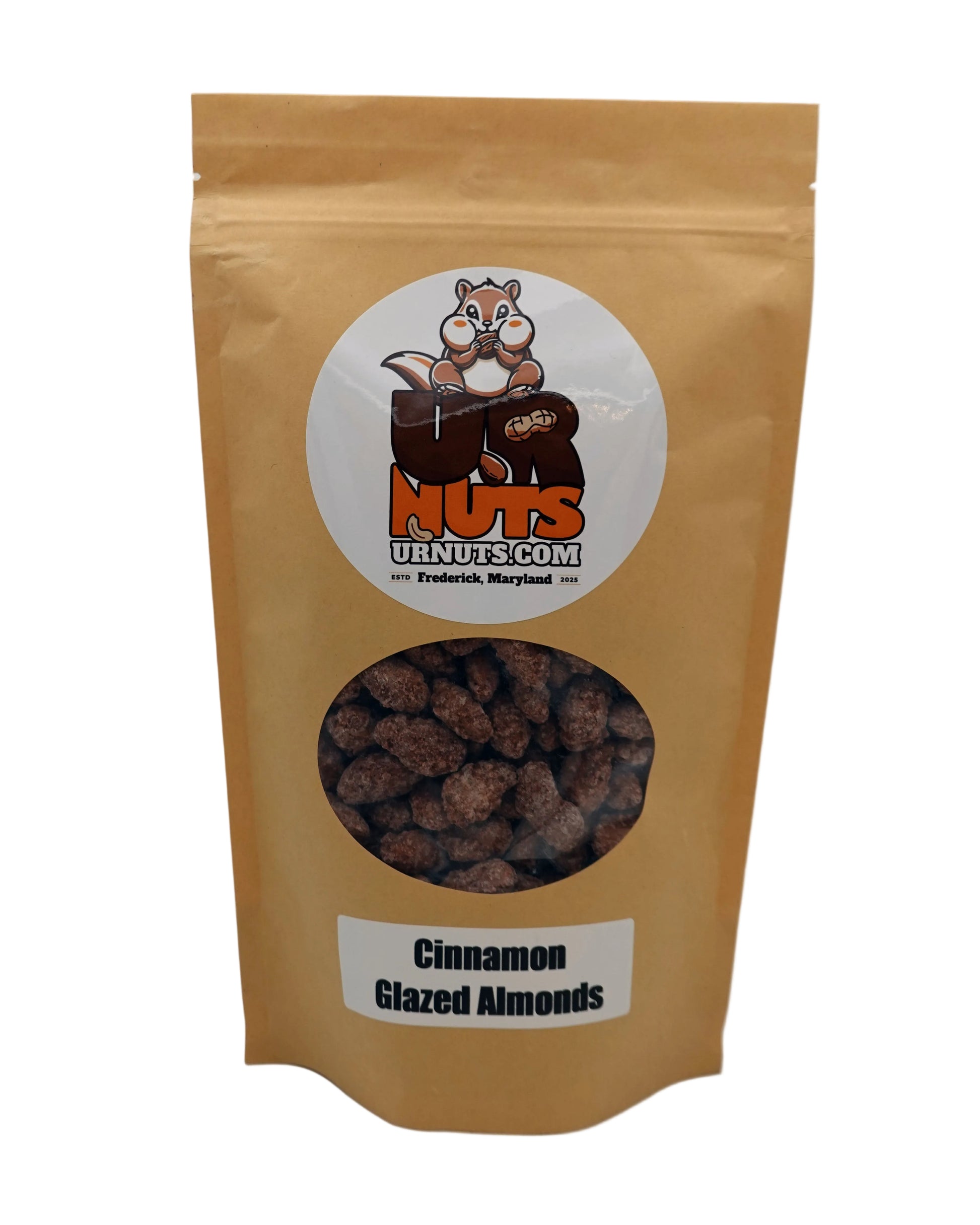 A stand-up kraft paper pouch of UR Nuts Cinnamon Glazed Almonds, featuring a circular cartoon squirrel logo and a clear window showing the brown almond pieces inside.