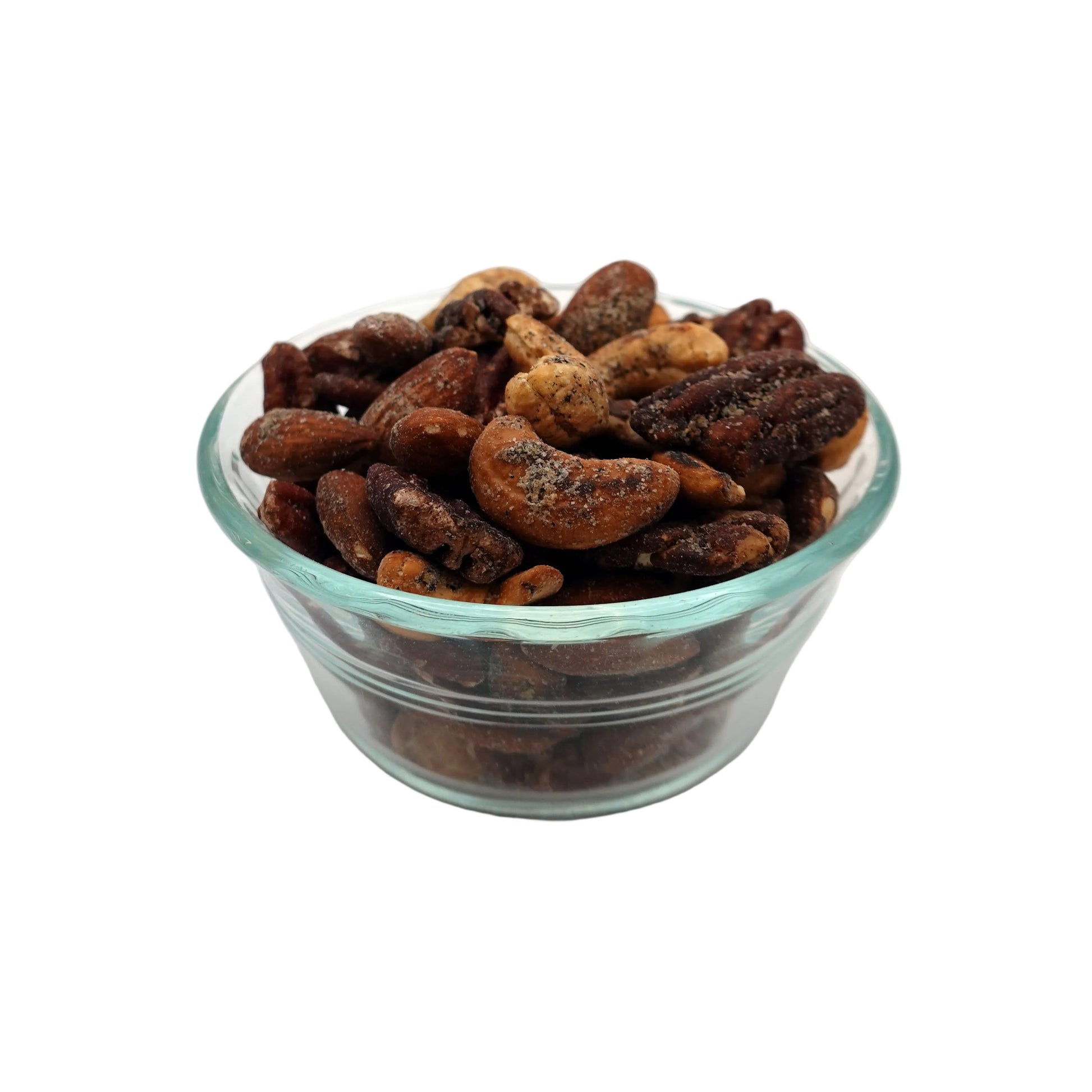 A clear glass bowl filled with Everything Bagel Seasoned Nuts, photographed from above on a plain white background.