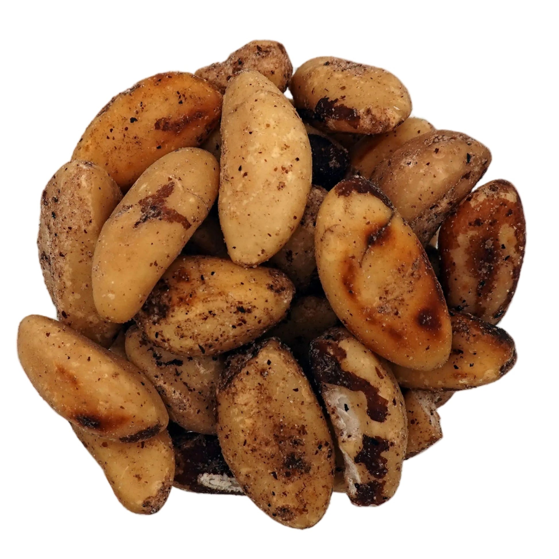 Roasted brazil nuts in a clear glass bowl, photographed from a top-down view on a plain white background.