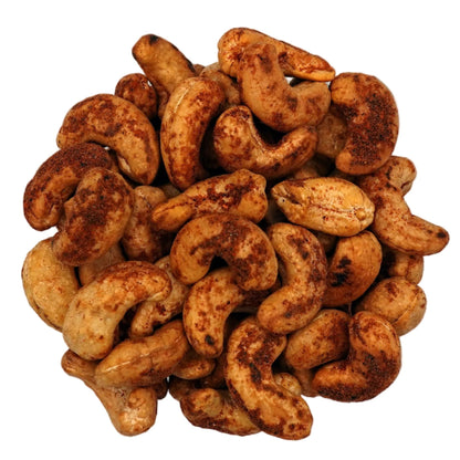 A top-down view of Spicy Habanero Cashews in a clear glass bowl, centered on a plain white background.