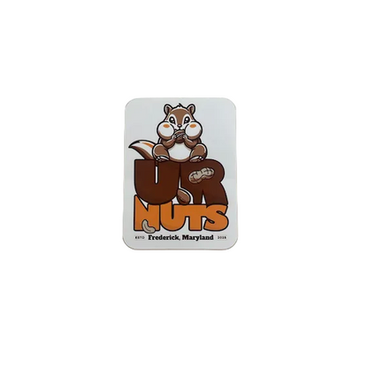 A square white sticker with rounded corners featuring a cartoon chippy the chipmunk above the words “UR NUTS” in brown and orange, with small text reading “Frederick, Maryland 2025” near the bottom, shown against a plain beige background.