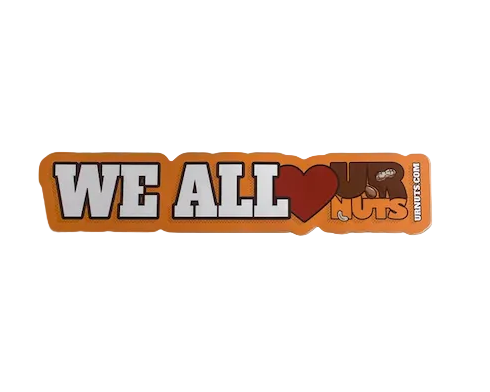 An orange bumper sticker with the text 'WE ALL LOVE UR NUTS', shown on a plain light gray background.